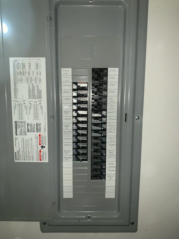 Finished Siemens electrical panel with a labeled circuit directory installed by Shocking Electric Solutions