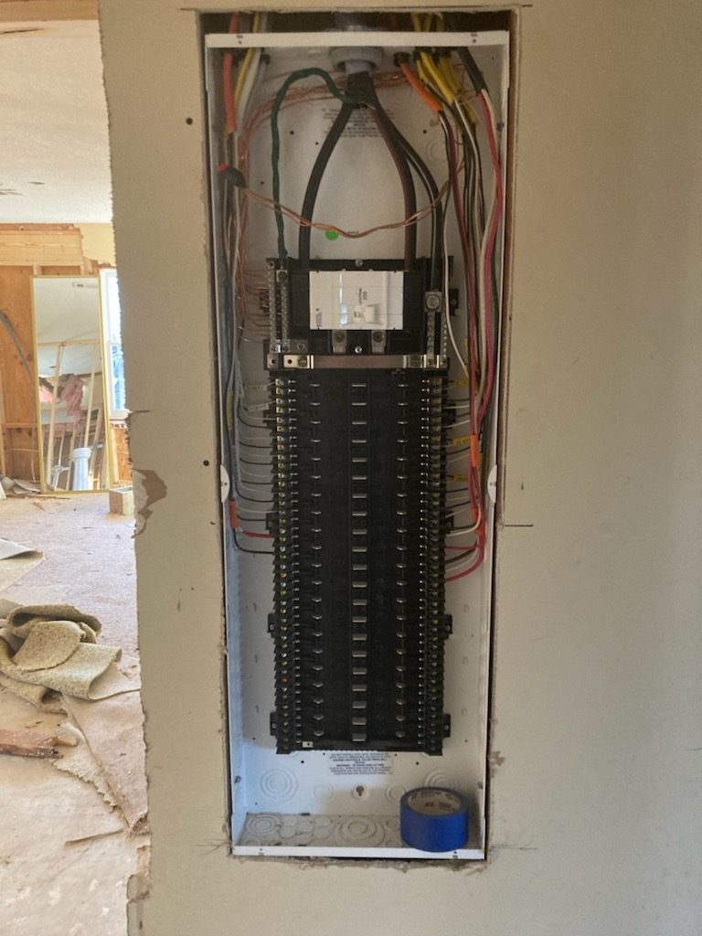 New residential electrical panel with the cover off, showing breakers and neatly routed wiring, installed by Shocking Electric Solutions