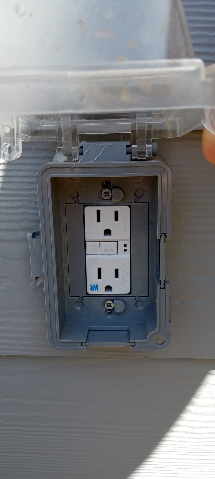 Outdoor GFCI outlet with a weatherproof in-use cover installed by Shocking Electric Solutions